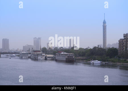 The nile, the Cairo tower with wide view in sunset, and the Kasr El-Nil bridge in Cairo, Egypt Stock Photo