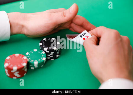 Hand closeup betting on baccarat table Stock Photo