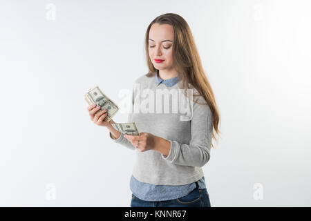 young woman holding dollars cash counting money. Stock Photo