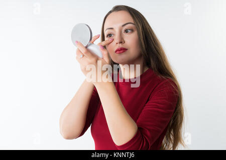 young beautiful hipster woman doing make-up Stock Photo