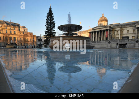 Ice forming in the fountains in Trafalgar Square, London, as Britain had its coldest night of the year with vast swathes of the country falling below freezing - with -13C (8.6F) recorded in Shropshire. Stock Photo