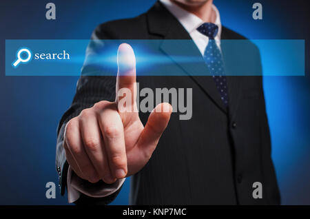 Virtual multimedia display. A man in a suit and tie clicks the "search" button on the virtual screen with his index finger. Screen Stock Photo