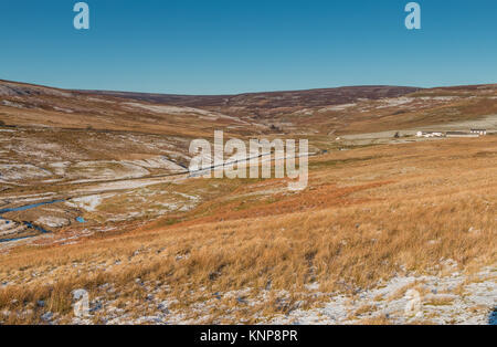 North Pennine landscape, Great Eggleshope beck and spoil heaps and remains of Wire Gill lead mine, Teesdale, in winter sunshine, with copy space Stock Photo