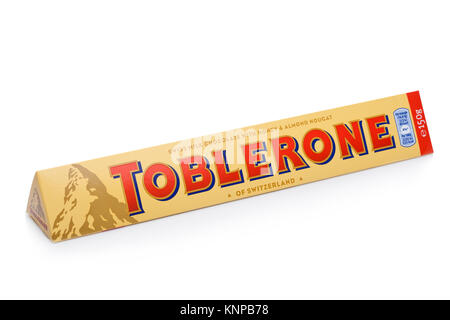 LONDON, UK -DECEMBER 07, 2017: Toblerone Swiss Milk Chocolate with Honey and Almond Nougat on white background. Toblerone is a Swiss chocolate. Stock Photo