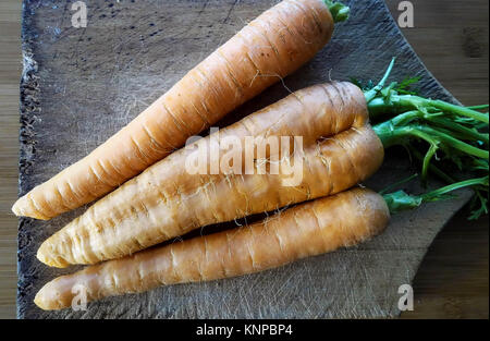 Organic Carrots on Chopping Board Stock Photo
