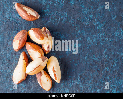 mix of cashew, pecan, pine nuts, hazelnuts on blue Stock Photo