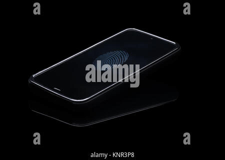 Fingerprint identification on cellphone. Smartphone isolated on blak background with fingerprint icon on screen. Stock Photo