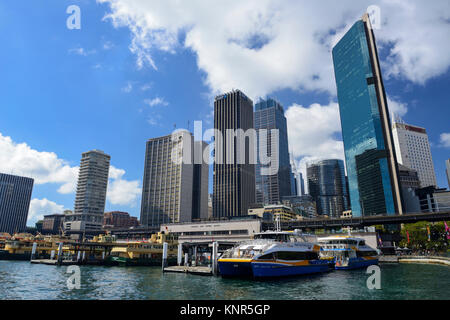 Ferry terminal on Circular Quay surrounded by high-rise buildings in Sydney Central Business District - Sydney, New South Wales, Australia Stock Photo