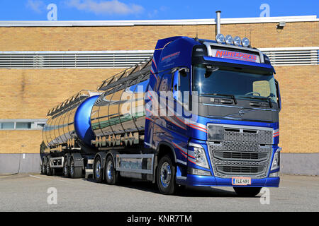 TURKU, FINLAND - SEPTEMBER 13, 2014: New Volvo FH tank truck by a warehouse. According to Cefic, The EU chemicals sales nearly double in 20 years, whi Stock Photo