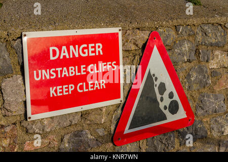 Warning sign on the beach near Torquay, Torbay, Devon UK Stock Photo