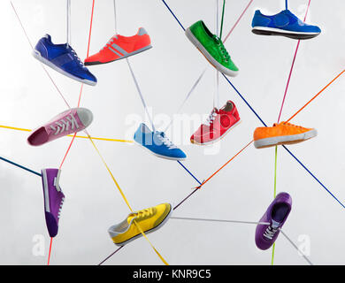 colorful sport shoes, one with laces Stock Photo