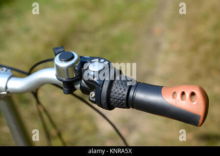 The bicycle handlebar with a gear selector and a close-up call Stock Photo