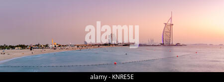 Panoramic view of Jumeirah Beach and world's famous Burj Al Arab hotel at sunset Stock Photo