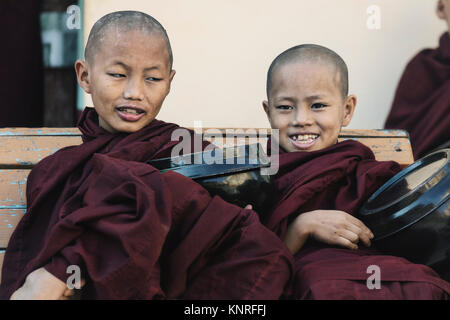 monks waiting for food in Myin Ka Bar, Bagan, Myanmar, Asia Stock Photo