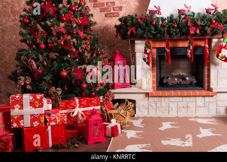 Many boxes with Christmas presents under the Christmas tree Stock Photo