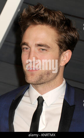 BEVERLY HILLS, CA - FEBRUARY 22:  Robert Pattinson attends the 2015 Vanity Fair Oscar Party hosted by Graydon Carter at Wallis Annenberg Center for the Performing Arts on February 22, 2015 in Beverly Hills, California  People:  Robert Pattinson Stock Photo