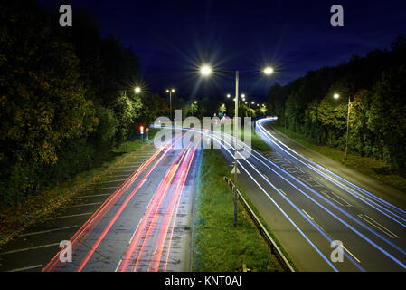 A slowly exposed shot of cars at night on the A441 in Redditch Stock Photo