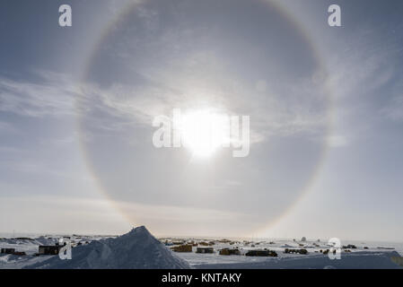 Sun dog shining bright in the sky over top of the south pole station. Stock Photo
