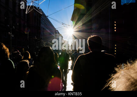 People Walking on Street Sun Flare City Crowd Silhouettes Sidewalk Outdoors Blue Sky Black Anonymous Stock Photo