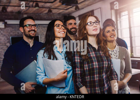 Happy group of successful company employees in office Stock Photo