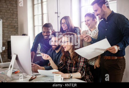 Company employees working in software development and designer office Stock Photo