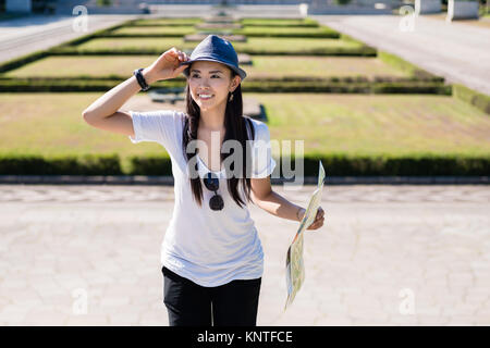 Happy Asian woman during summer vacations Stock Photo