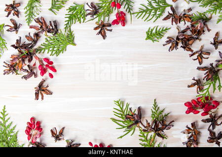 Tiny pine cones with mistletoe and fir branches with copy space Stock Photo