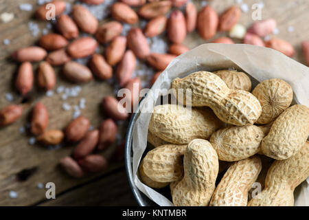 Salted peanuts on a paper bag Stock Photo