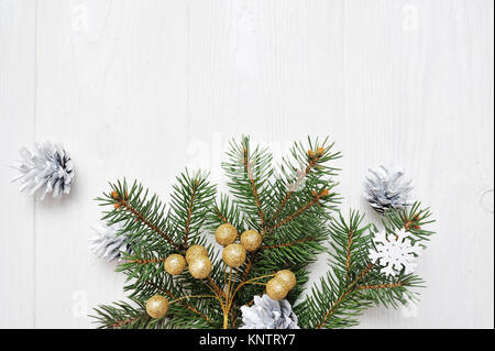 Mockup Christmas tree branch flatlay on a white wooden background, with place for your text Stock Photo