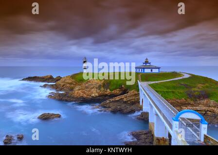 View of Pancha Island in Ribadeo, Lugo before a storm. Stock Photo