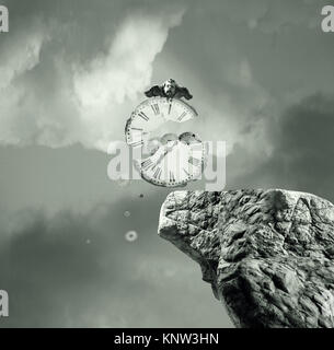 Surreal conceptual image representing a broken clock falling down from a rock Stock Photo