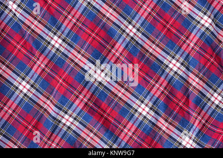 wrinkled fabric in a cage with red blue, background Stock Photo