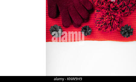Knitted scarf and hat on the table. Stock Photo