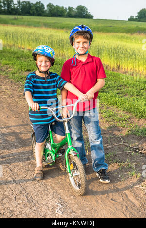 Sporty children in helmets with bikes Stock Photo