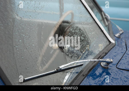 Wiper blades on a wet windscreen, old classic car Stock Photo