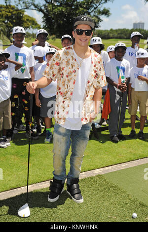 MIAMI BEACH FL - JUNE 18: DJ Irie and Austin Mahone attend the Inspire Kids Golf Clinic during The 11th Annual Irie Weekend at the Miami Beach Golf Club on JUNE 18, 2015 in Miami Beach, Florida   People:  Austin Mahone Stock Photo