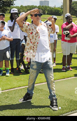 MIAMI BEACH FL - JUNE 18: DJ Irie and Austin Mahone attend the Inspire Kids Golf Clinic during The 11th Annual Irie Weekend at the Miami Beach Golf Club on JUNE 18, 2015 in Miami Beach, Florida   People:  Austin Mahone Stock Photo