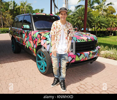 MIAMI BEACH FL - JUNE 18: DJ Irie and Austin Mahone attend the Inspire Kids Golf Clinic during The 11th Annual Irie Weekend at the Miami Beach Golf Club on JUNE 18, 2015 in Miami Beach, Florida   People:  Austin Mahone Stock Photo