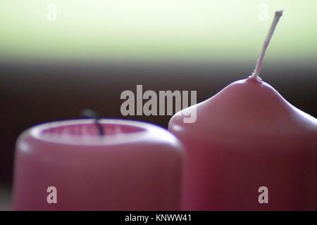 intended blur of two pink candles Stock Photo