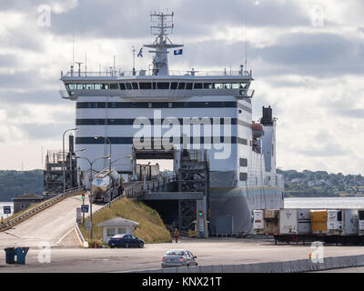 Trucks load into MV Blue Puttees ferry, North Sydney, Nova Scotia, Canada. Stock Photo