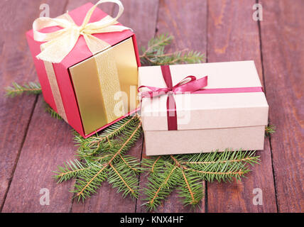Christmas fir tree with gift boxes on wooden board Stock Photo