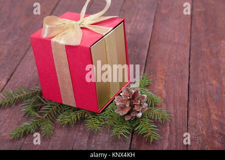 Christmas fir tree with gift boxes on wooden board Stock Photo