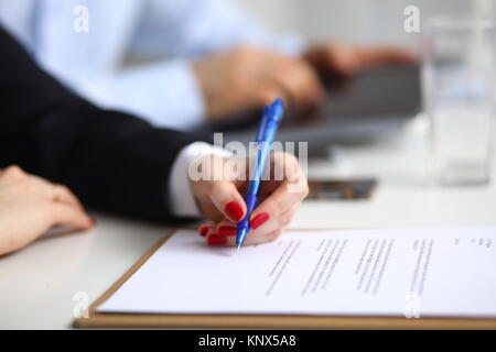 Businesswoman sitting in office, working with laptop computer Stock Photo