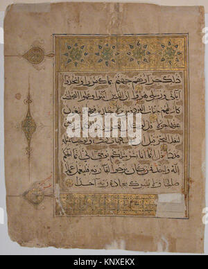 This folio from a Qur'an manuscript contains Arabic script on paper and ...