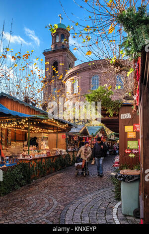 Germany, Frankfurt am Main,Traditional German Christmas market with stalls selling gifts and food outside Paulskirche, St. Paul’s Church on Paulsplatz Stock Photo