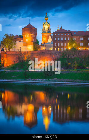 Krakow Wawel Castle night, view of the illuminated Castle fortifications and cathedral tower on Wawel Hill, Krakow, Poland. Stock Photo