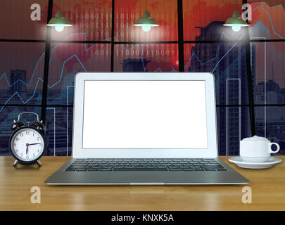 Workspace with computer laptop on the wood table with the windows which shown trading graph on the blurred photo of cityscape building background, tra Stock Photo