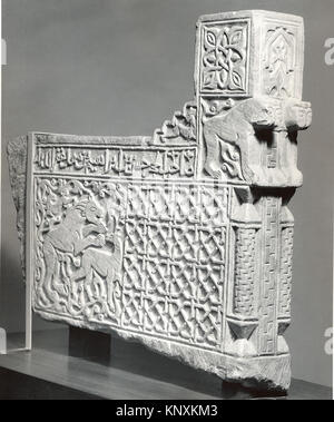 Carved limestone balustrade end from early 14th-century Iran, decorated with geometric relief patterns. Stock Photo