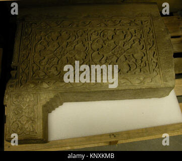 Carved limestone balustrade end from 14th-century Iran, decorated with geometric relief patterns typical of Islamic architecture. Stock Photo
