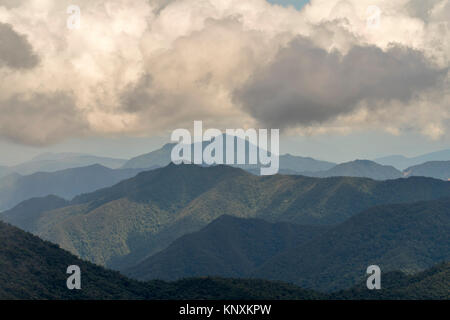 Cumulus clouds forming over the Cordillera del Condor on the border of Ecuador with Peru. This pristine mountain range is a site of exceptional plant  Stock Photo